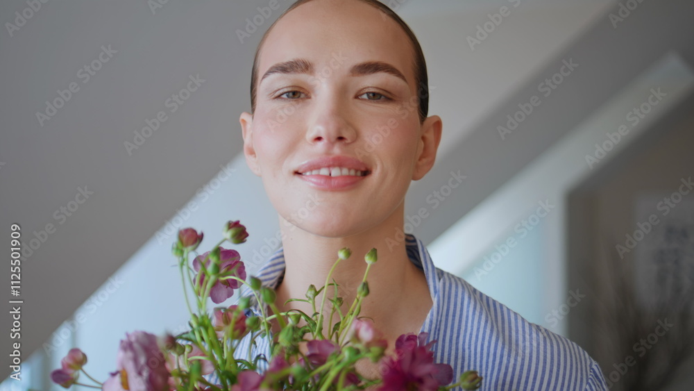 Sensual girl carrying bloom looking camera at white ceiling apartment portrait Sensual girl carrying bloom looking camera at white ceiling apartment portrait