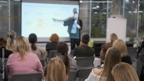Wallpaper Mural Business presentation with audience focusing on speaker. Professional environment, modern office setting. Torontodigital.ca