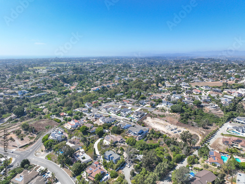 Aerial view of middle class houses in the valley of Oceanside town in San Diego, California. USA.