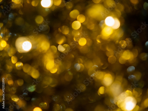 Abstract golden bokeh background. Festive defocused background.