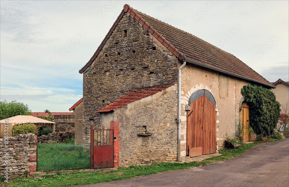 Ancient traditional barn used for viticulture with large curved double doors