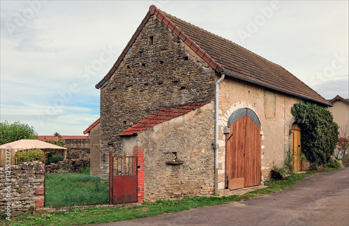Ancient traditional barn used for viticulture with large curved double doors