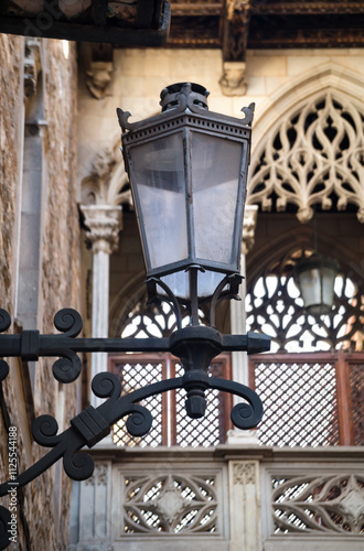 Old street lantern lighting on facade of building. City street, building illumination. Retro lantern lighting Street lights, illumination and vintage lantern.