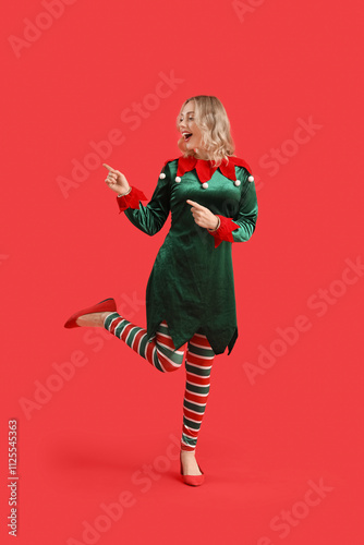 Happy young woman dressed a...