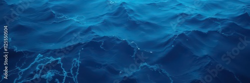 Abstract image of a vibrant deep blue sea texture with swirling patterns and textures, waves, nautical