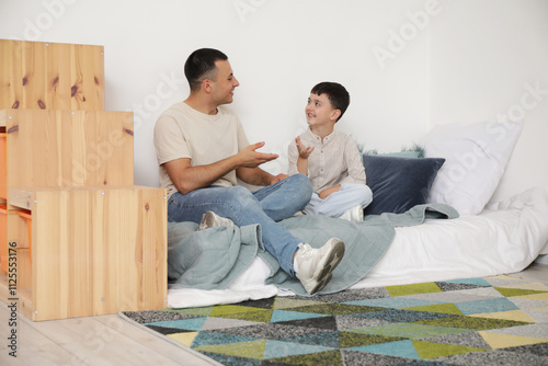 Cute little boy with his fa...