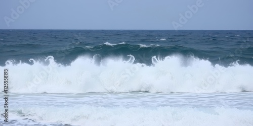 Powerful ocean wave crashing on a rocky shore during a storm, splash, dangerous