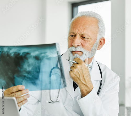 doctor hospital female man senior elderly active medical x-ray x ray radiology lung chest diagnisis disease health medicine healthcare clinic  office photo