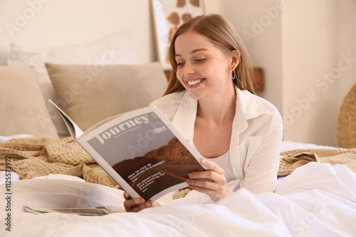 Young woman reading magazin...