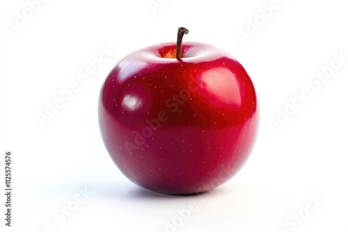 A single red apple sitting on a white background photo