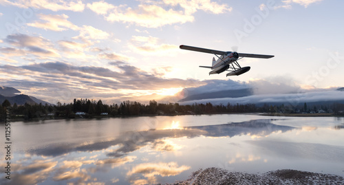 Floatplane Flying Over Lake With Scenic Reflections in British Columbia photo