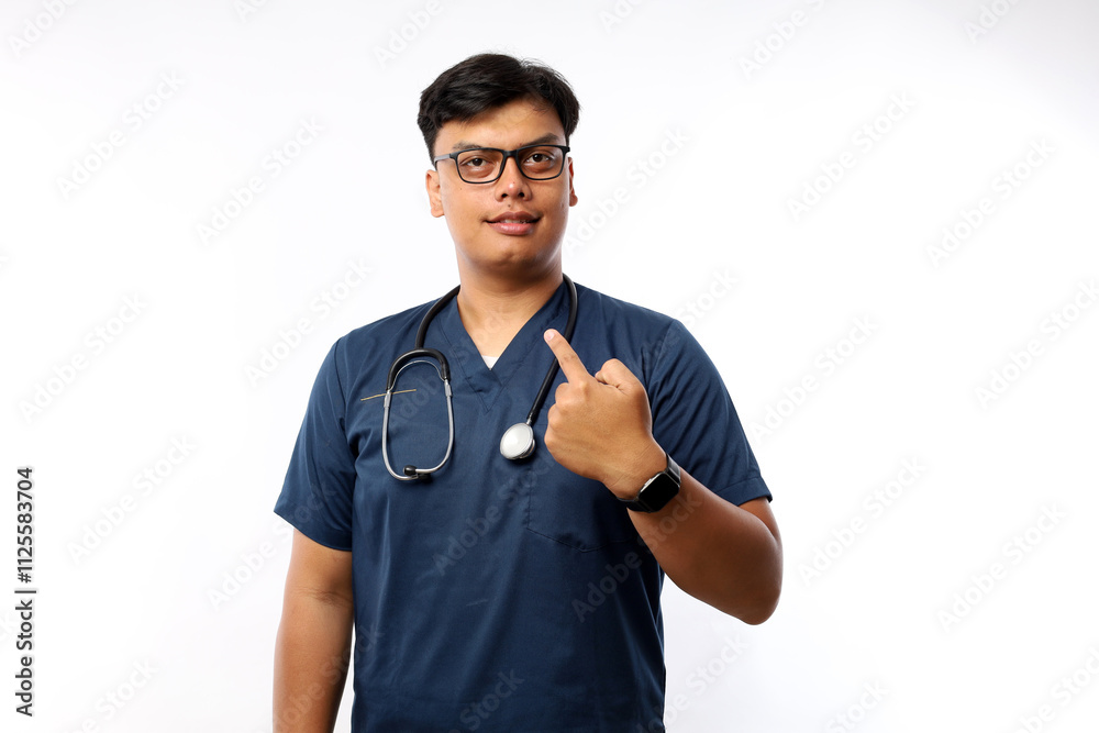 Nursing assistant in white background pointing with finger at you as if inviting come closer.