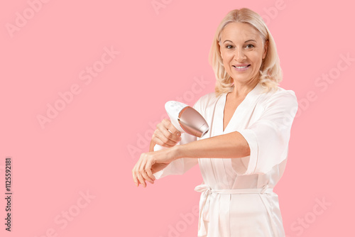 Mature woman using photoepi...