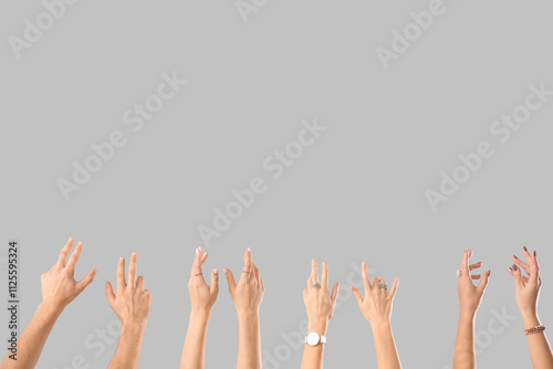 Many hands on light background