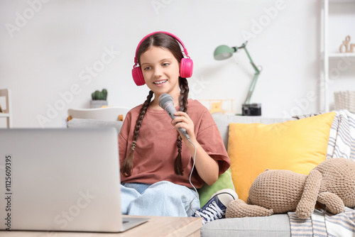 Cute girl with microphone r...