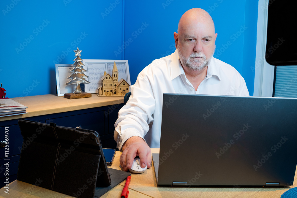 Working from home using the internet to connect, this is an older person using this technology Working from home using the internet to connect, this is an older person using this technology