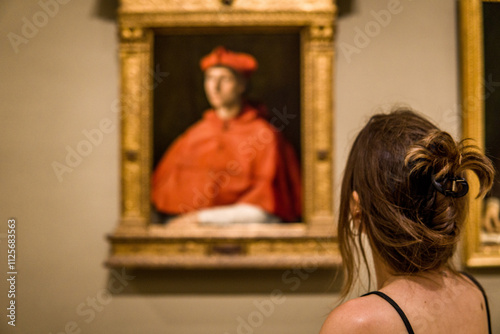 Foreshortening of a Woman Admiring the Beauty of a Medieval Painting in a Museum