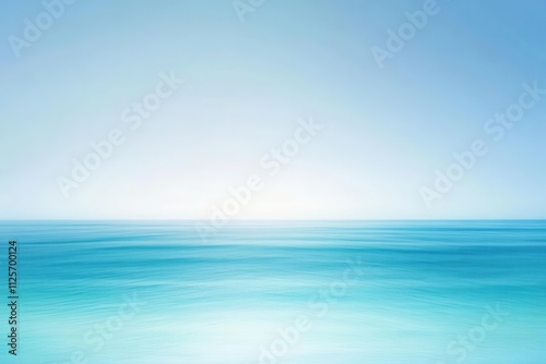 A serene seascape with a gradient of blue hues blending into a clear sky.