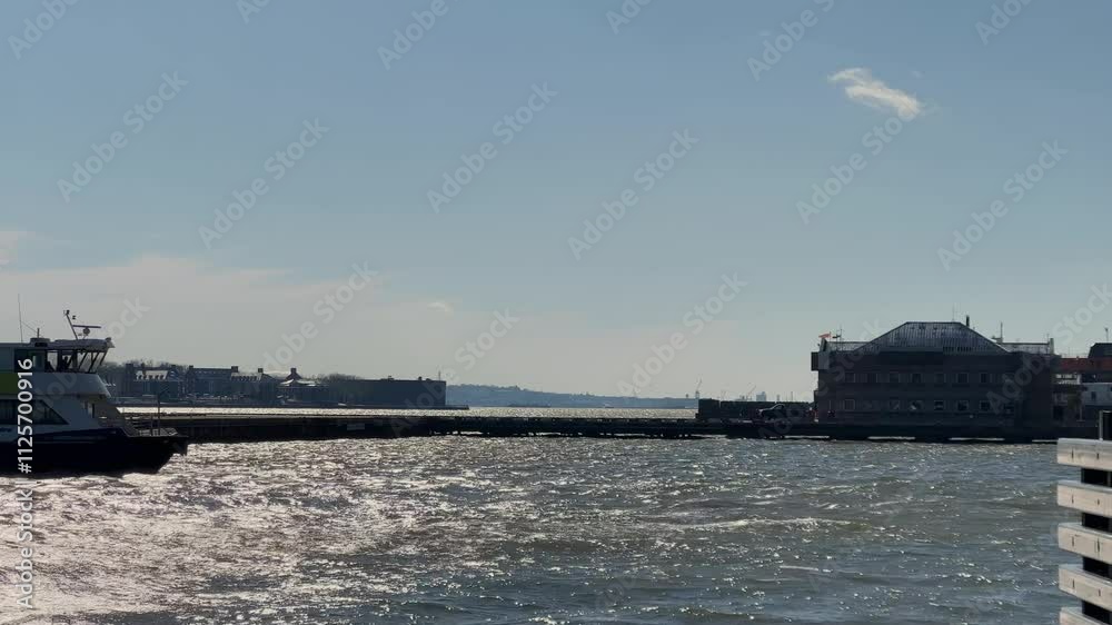 View of the scenic harbor featuring a ferry on a beautifully sunny day View of the scenic harbor featuring a ferry on a beautifully sunny day