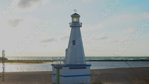 A small lighthouse on the shore of Lake Michigan