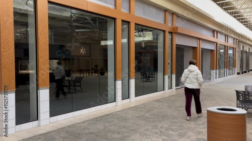 Wallpaper Mural Woman walks through Mall Hallway with no stores - 1 Torontodigital.ca