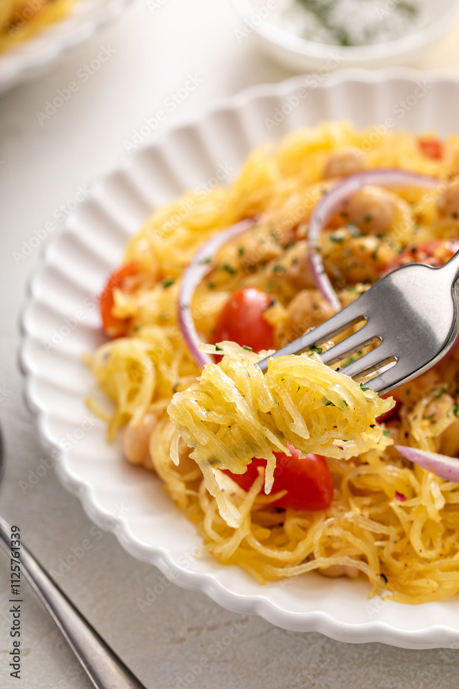 Spaghetti squash with chickpeas and tomatoes topped with red onion, low carb vegan recipe idea Spaghetti squash with chickpeas and tomatoes topped with red onion, low carb vegan recipe idea