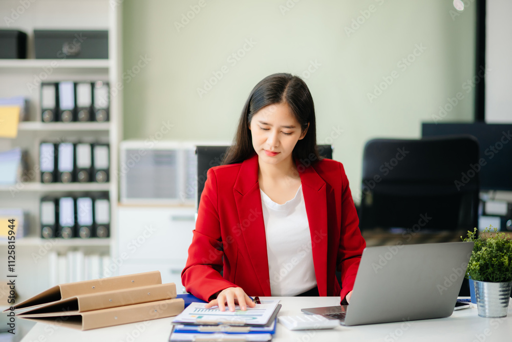 Confident business expert attractive smiling young woman typing laptop and holding digital tablet Confident business expert attractive smiling young woman typing laptop and holding digital tablet