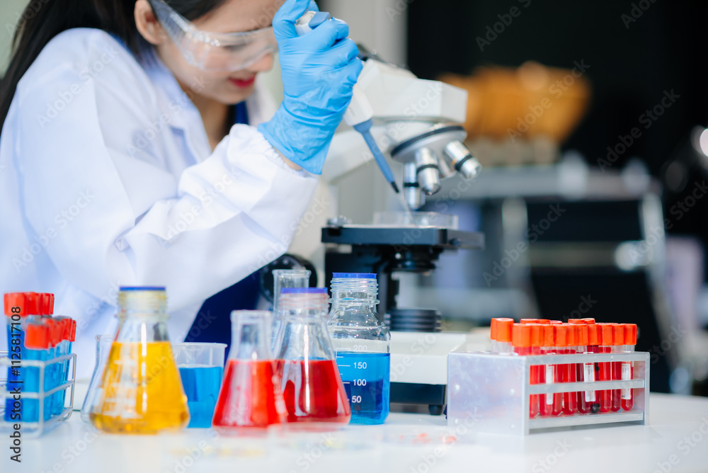 Discover a dedicated scientist conducting laboratory research, using pipettes, microscopes, and lab equipment. Discover a dedicated scientist conducting laboratory research, using pipettes, microscopes, and lab equipment.