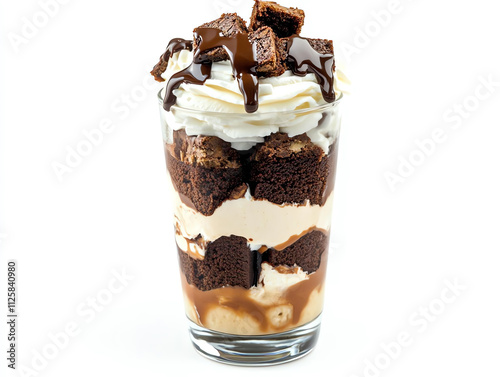 Delicious dessert featuring layers of brownie, ice cream, whipped cream, and chocolate sauce in a glass. photo