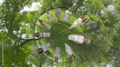 Immerse yourself in a mesmerizing 360-degree journey as 11 graceful women, adorned in elegant white dresses, form a circle and dance joyously in the heart of a lush green forest. Their movements are