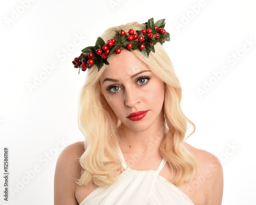 close up portrait of beautiful blonde female model wearing holly and ivy Christmas  fantasy wreath crown headdress. isolated silhouette on white studio background. photo