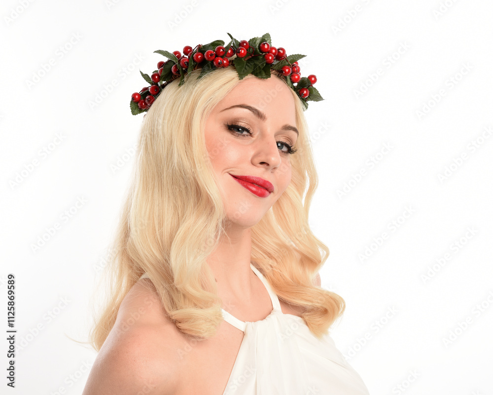 Naklejka premium close up portrait of beautiful blonde female model wearing holly and ivy Christmas fantasy wreath crown headdress. isolated silhouette on white studio background.