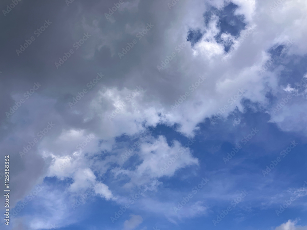 Stormy Elegance: Brooding Dark Clouds Transitioning into Vibrant Blue Skies Stormy Elegance: Brooding Dark Clouds Transitioning into Vibrant Blue Skies