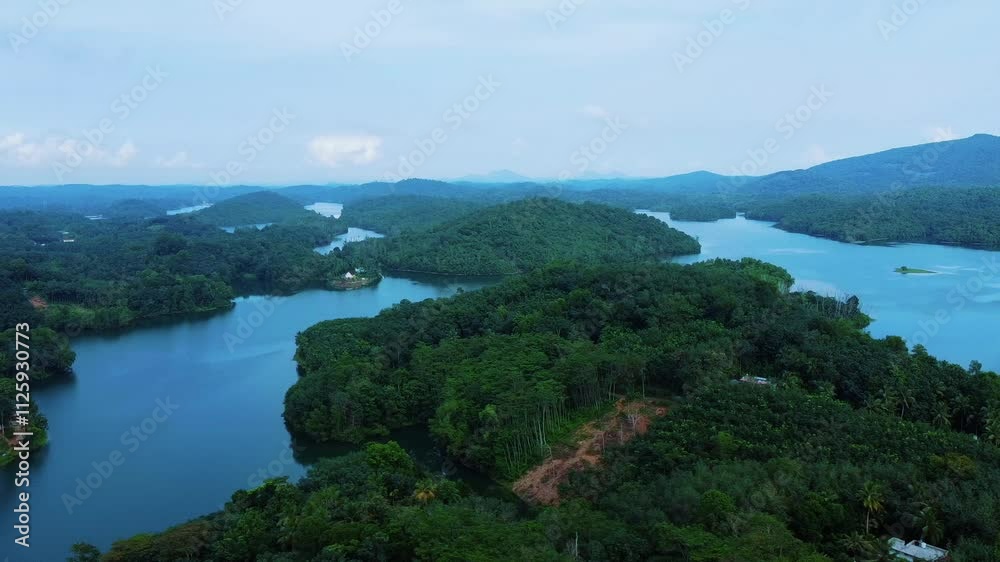 Hill station view , Areal view of a Beautiful reservoir dam in Kerala, India, Morning view of Neyyar dam, Mountains and small green islands are seen in this video Hill station view , Areal view of a Beautiful reservoir dam in Kerala, India, Morning view of Neyyar dam, Mountains and small green islands are seen in this video