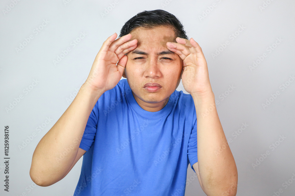 eye problems man holding glasses and squinting eyes eye problems man holding glasses and squinting eyes