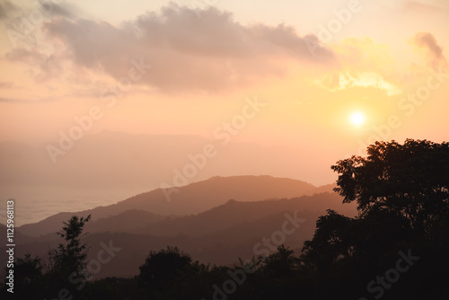 landscape and travel concept with sunrise and layer of mountain and mist with forest on morning