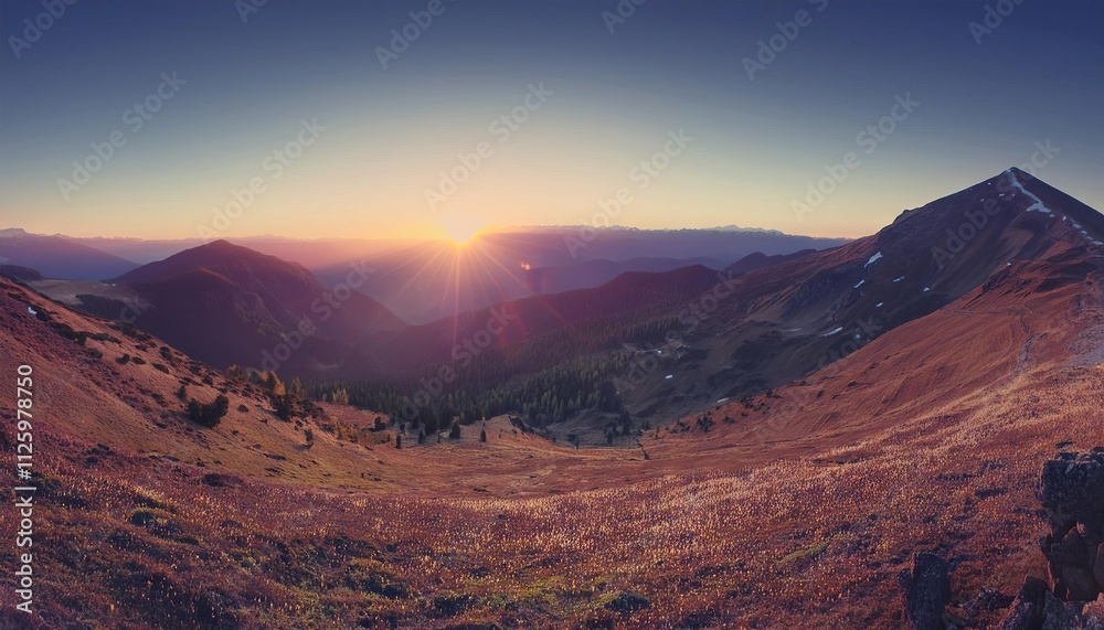 A beautiful mountain landscape with snow-capped peaks during sunset and sunrise A beautiful mountain landscape with snow-capped peaks during sunset and sunrise
