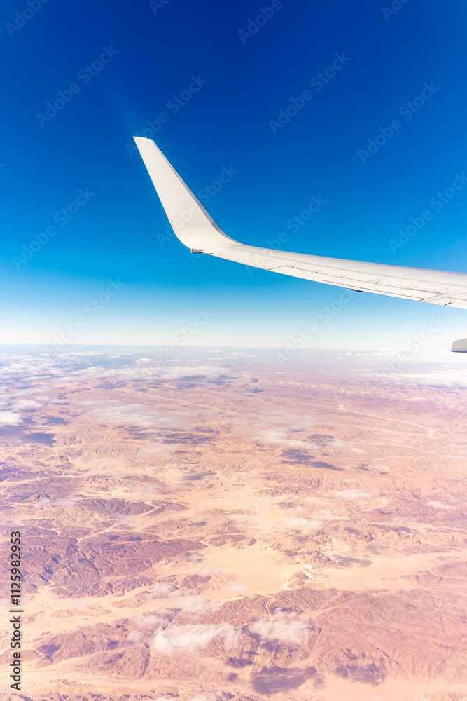Aerial view on arabian desert and Red sea mountains from airplane Aerial view on arabian desert and Red sea mountains from airplane