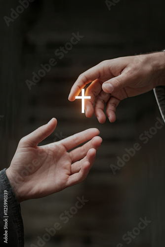 A close-up of two hands reaching toward each other, one holding a small glowing cross symbol photo