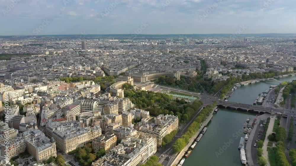 Aerial view of the Seine River and historic buildings in Paris, highlighting the citys vibrant architecture and greenery Aerial view of the Seine River and historic buildings in Paris, highlighting the citys vibrant architecture and greenery