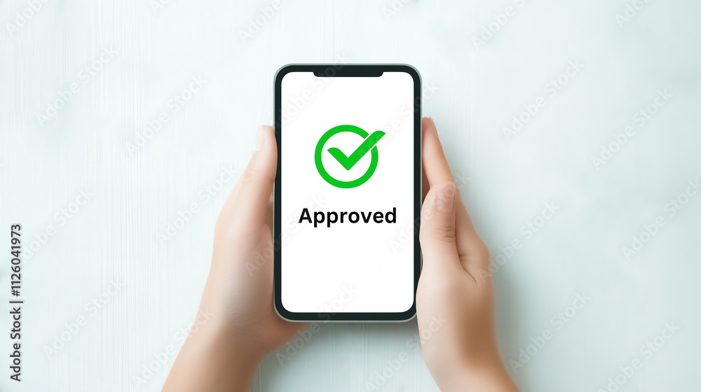 Smartphone displaying approved checkmark symbol on screen Smartphone displaying approved checkmark symbol on screen