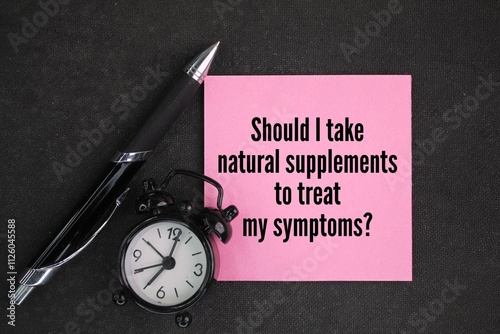 bell clock, pen and pink paper with the question Should I take natural supplements to treat my symptoms? Questions About Menopause