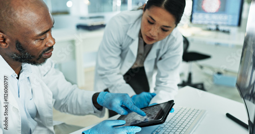 Science, team and tablet in lab for discussion, brainstorming and innovation for medicine development. Scientists, man pointing or tech at desk for investigation, neuroscience or brain scan on screen