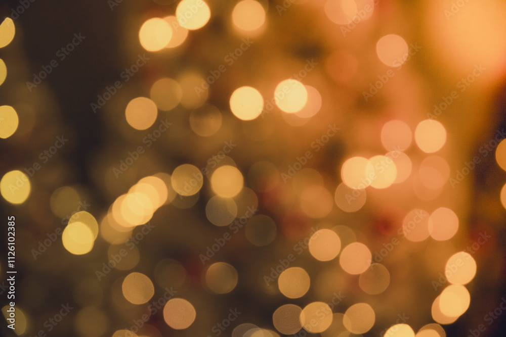 A warm Christmas bokeh background from the lights on a tree. A warm Christmas bokeh background from the lights on a tree.
