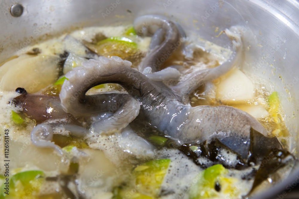 boiling seafood stew with octopus and vegetables boiling seafood stew with octopus and vegetables
