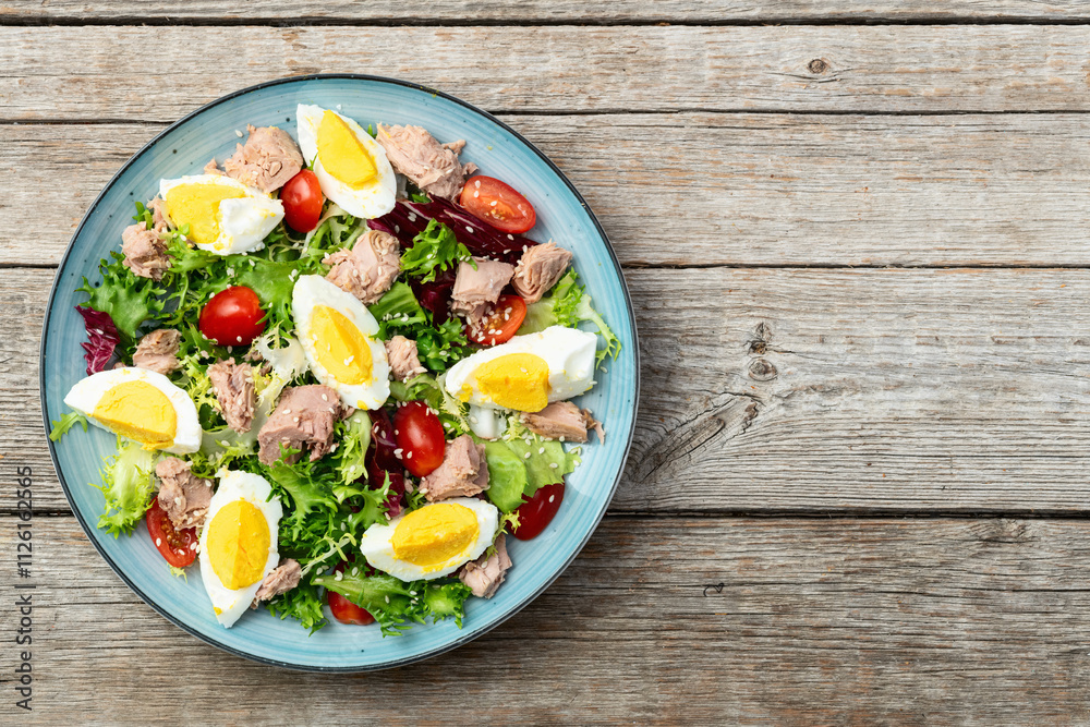 Canned Tuna salad with eggs and tomatoes photography . Top view Canned Tuna salad with eggs and tomatoes photography . Top view