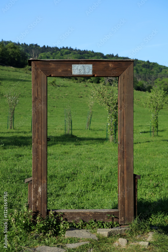 Symbolic door in former, abandoned village - Nieznajowa in Low Beskid mountain range, Poland