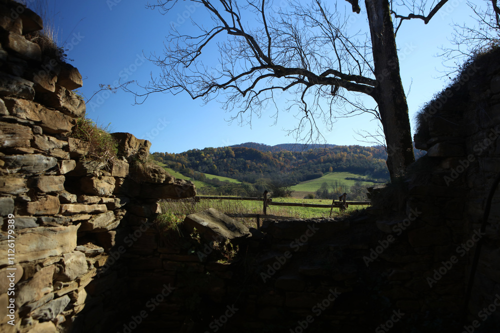 Landscape of old abandoned village Krywe with ruins of orthodox church in Bieszczady Mountains, Poland Landscape of old abandoned village Krywe with ruins of orthodox church in Bieszczady Mountains, Poland