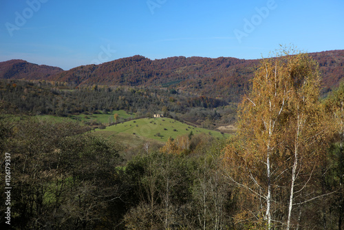 Fototapeta Naklejka Na Ścianę i Meble -  Landscape of old abandoned village Krywe with ruins of orthodox church in Bieszczady Mountains, Poland