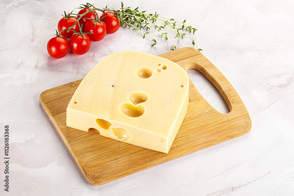 Maasdam cheese brick over board Maasdam cheese brick over board